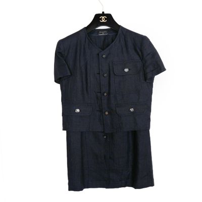 a black shirt and skirt are hanging on a hanger