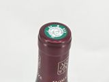 a bottle of wine that is sitting on a table