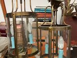 two lamps that are on top of a table