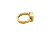 a close up of a gold ring on a white background