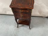 an old wooden table with a drawer on top of it