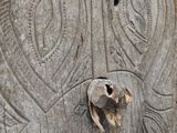 a stone carving of an elephant with a skull in it ' s mouth