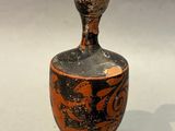 a vase that is sitting on a white surface