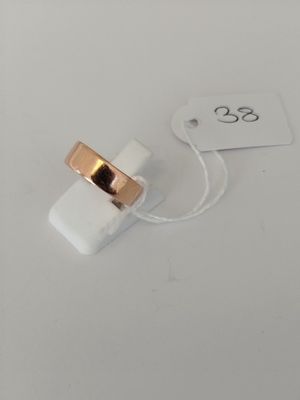a close up of a ring on a white surface with a price tag