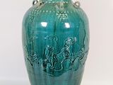 a green vase with a handle on a white background