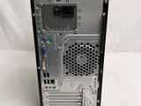the back of a computer case with a fan and power supply