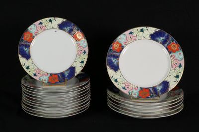 many plates stacked on top of each other on a black surface