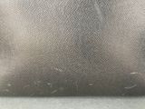 a close up of a bag on a table with a cloth covering it