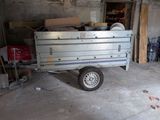 a small trailer that is parked in a garage
