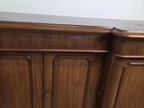 an image of a wooden cabinet with a marble top