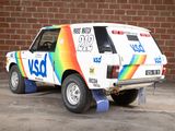 a van that is parked in front of a brick wall