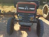 a tractor that is parked in the dirt