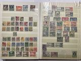 a book with stamps on the pages and a picture of a man