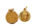 two gold - plated medallions of a woman and a man