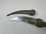 pair of antique silver plated daggers on a white surface