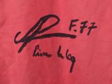 the back of a red t - shirt with a black writing on it