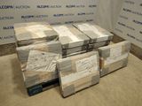 several stacks of boxes are stacked on top of each other in a room