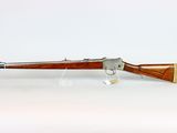 an old rifle with a wooden handle and a wooden barrel