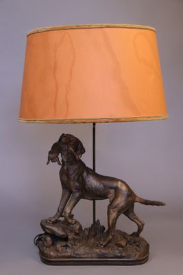 an image of a lamp with a dog on it and a lamp shade on it