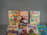 a lot of comic books sitting on a table
