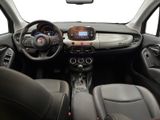 the interior of a small car with a steering wheel and dashboard