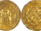 two gold sovereigns, one of which has a depiction of a man and woman on it