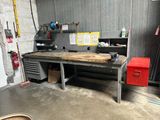 a workbench in a garage with a lot of tools on it