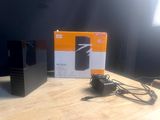 a box with a charger and a charger sitting on a table