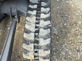 a close up of a tractor tire tracks on the ground