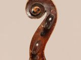 an old violin with a wooden back and a long neck