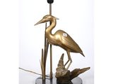 an image of a bronze heron lamp on a black base