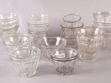 a lot of glasses that are sitting on a table