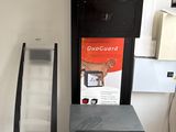 a refrigerator and a microwave in the corner of a room