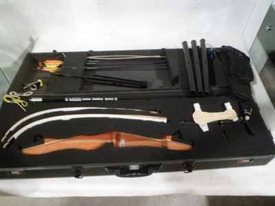 a black case with tools in it on a white surface