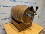 a wooden barrel with a tap on top of it