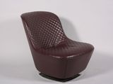 leather lounge chair with quilted seat and foot rest