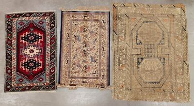 three rugs are laid out on the floor in a row