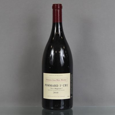 a bottle of red wine sitting on a glass table