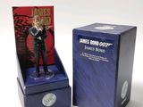 a figurine of james bond on display in a box