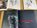 three pages of comics are spread out on a table