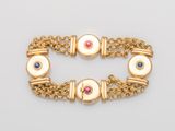 un bracelet en or 18 carats orné de pierres multicolores