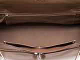 the inside of a brown purse with a zipper on the inside