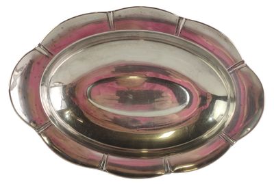 a silver plate with a pink center on a white background