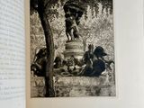 a black and white picture of a fountain in a park