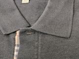 the back of a grey polo shirt with a checkered collar