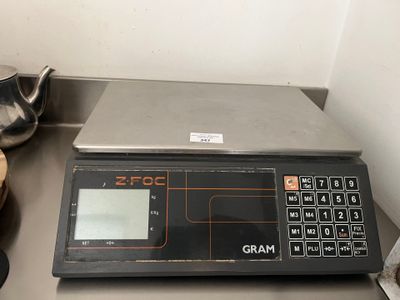 an image of a digital scale sitting on top of a kitchen counter
