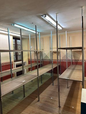 a room with a lot of shelves in it