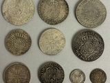six different types of coins are shown on a white surface
