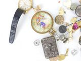 many different types of watches and jewelry on the table