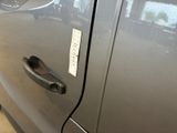 a close up of a car door handle with a sticker on it